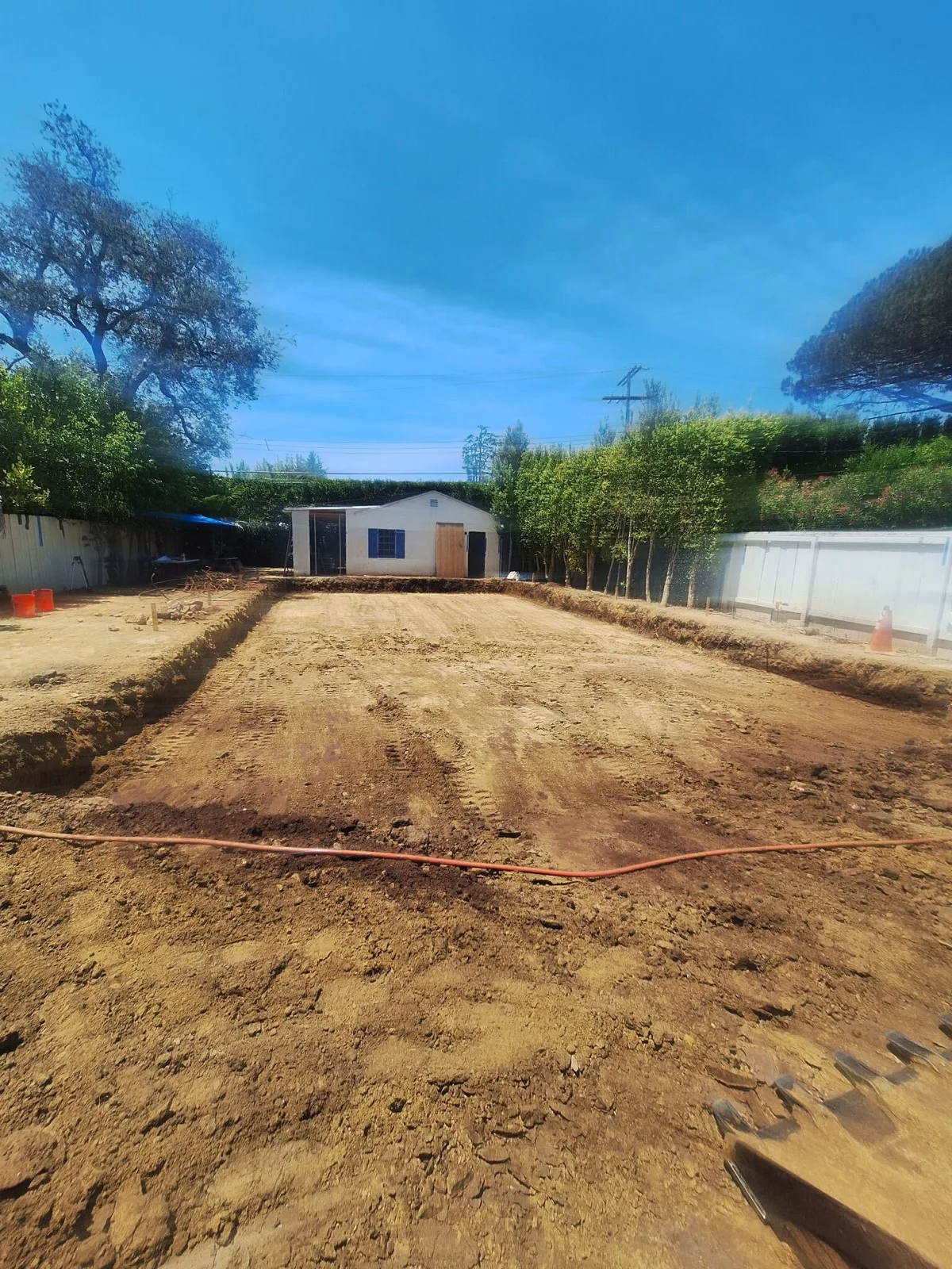 Backyard lot graded level by Southwest Hauling on a Westside job
